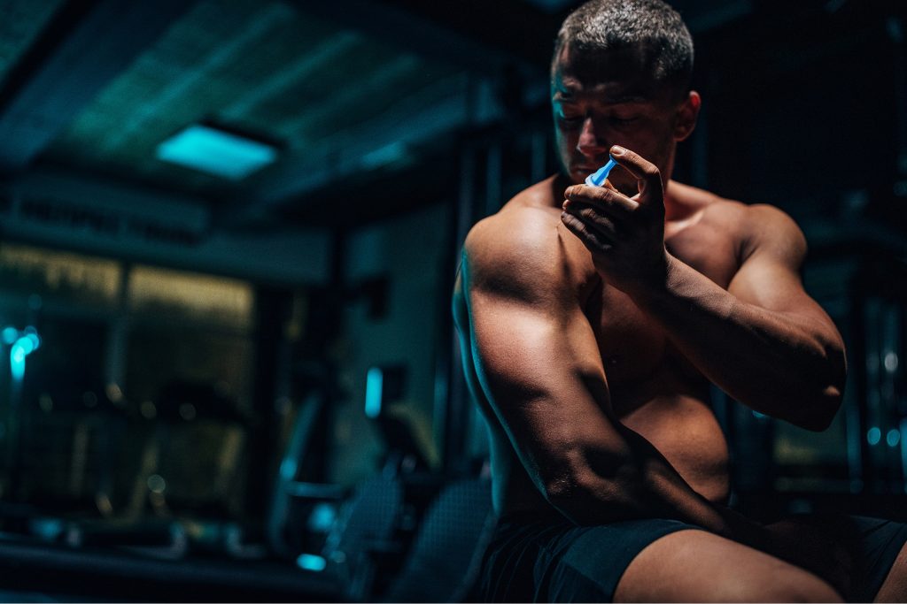 Man injecting steroids in shoulder